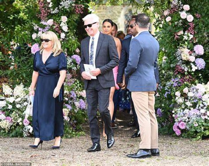 Celebrity guests: Phillip beamed as he joined the hoards of guests arriving at the wedding which is taking place in Hampshire